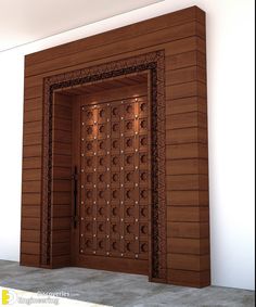 an open wooden door in front of a white wall