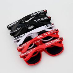 six pairs of sunglasses with the words happy on them in red, white and black