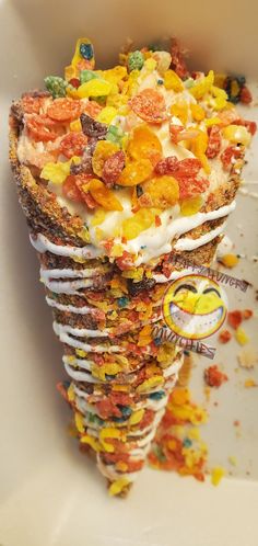 an ice cream sundae with lots of toppings on it's top and bottom