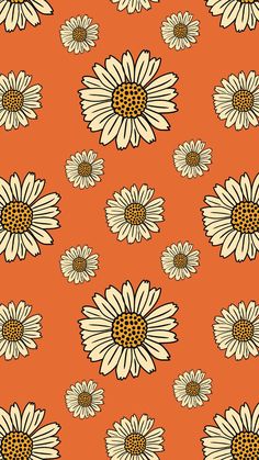 an orange and white flower pattern with black spots on the petals is shown in this image