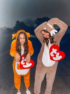 two women in costumes standing next to each other