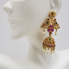 "This beautiful earrings set has an excellent finish and gives out an exquisite sense of style. If you are looking for an amazing Fashion Jewelry set for special occasions such as Anniversary, Engagement, Party, Wedding, or for gifting, then your search ends here. Handmade Indian Temple Jewelry, best to wear it for traditional ceremonies or Indian wedding. This bridal jewelry has an ethnic finish. It has Cubic Zircon stones with semi-precious ruby and emeralds. It is a Bollywood style one gram j Elegant Heavy Pearl Earrings For Festive Occasions, Traditional Festive Pearl Earrings With Elegant Design, Elegant Heavy Pearl Earrings For Festivals, Gold Plated Pearl Earrings For Celebrations In Temple Style, Gold Plated Temple Style Pearl Earrings For Celebration, Gold Plated Temple Jewelry Pearl Earrings For Celebration, Temple Jewelry Sets With Pearl Drop For Celebration, Elegant Peacock Design Chandelier Earrings For Festive Occasions, Elegant Kundan Jhumkas For Celebration