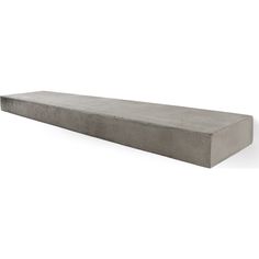 a concrete bench sitting on top of a white floor