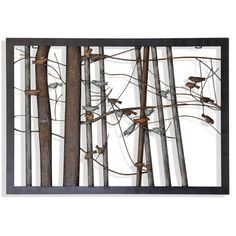 a metal wall sculpture with birds perched on the branches