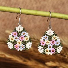 Feel the caress of the spring season with these blooming dangle earrings by Yanina Mirzoyan of Armenia. The artisan works with glass beads in a palette of green and pastel hues, which allow her to recreate the region's floral scapes. The earrings, in a stylish triangle shape, have comfortable sterling silver hooks. Beaded Spring Earrings, Spring Multicolor Teardrop Jewelry, Spring Drop Beaded Earrings Gift, Spring Beaded Drop Earrings For Gift, Multicolor Teardrop Earrings For Spring, Spring Gift Beaded Drop Earrings, Spring Multicolor Teardrop Earrings, Spring Gift Teardrop Dangle Earrings, Spring Colorful Beaded Drop Earrings