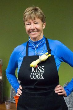 a woman wearing an apron with a banana on it