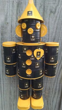 a stack of black and yellow cups sitting on top of each other