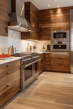 a modern kitchen with stainless steel appliances and wood cabinets