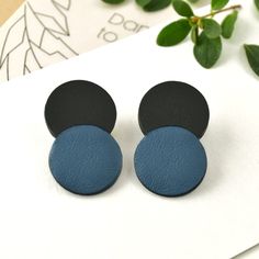 Minimalistic geometric double dot stud earrings made from real leather. Double circle stud earrings for everyday use.  Round form two-tone earrings made from blue and black leather is very lightweight. This is a handmade leather accessory with acrylic painted edges. Materials: leather, stainless steel, rubber, and iron earring backs, acrylic paint Color: Blue and black Length: 1.58 in / 4 cm  Width: 0.98 in / 2.5 cm *Made with 100% genuine leather *Handmade *Minimalist accessory Dare to DREAM! I Heavy Sweating, Leather Accessories Handmade, Colorful Paintings Acrylic, Earrings Double, Circle Stud Earrings, Minimalist Accessories, Circle Earrings Studs, Circle Studs, Painting Edges