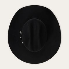 Corral 4X Buffalo Black Felt Cowboy Hat by Stetson SBCRAL-9442-07 Part of our Buffalo collection, this cowboy hat is made in the USA of high-quality, weather-resistant 4X buffalo felt. Its classic Western profile features a classic cattleman crease, a 4" brim and a 4 5/8” regular oval crown. Additional details include a leather sweatband, satin lining, and a self-matching hat band with a three-piece silver-toned buckle set, as well as a Stetson hat box. 4" Brim 4 5/8" Regular Oval Crown Cattlema Black Felt Cowboy Hat, Felt Cowboy Hat, Packable Sun Hat, Boys Cowboy Boots, Lifeguard Hat, American Flag Hat, American Buffalo, Girl Cowboy Boots, Twisted X Boots