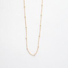 H I G H L I G H T S• Non-Tarnishing 14k Gold Filled Chain • Lobster Clasp Closure • Available In 14”, 16”, 18”, and 20” LengthsOur dainty gold necklaces are a great way to carry your most special moments with you! These simple and minimal necklaces are made to suit anyone. Each item is made to order, so you know your piece will be completely unique to you or your recipient! O R D E R I N G1. Select the options from the drop down box2. Add to cartA B O U T • T H I S • P I E C E This necklace is m Minimalist Station Necklace With Satellite Chain As A Gift, Minimalist Station Necklace With Satellite Chain For Gift, Dainty Station Necklace With Satellite Chain, Dainty Everyday Necklace With Satellite Chain, Delicate Everyday Jewelry With Ball Chain, Everyday Dainty Necklace With Satellite Chain, Dainty Everyday Necklace With Beaded Chain, Minimalist Ball Chain Jewelry Gift, Dainty Satellite Chain Necklace