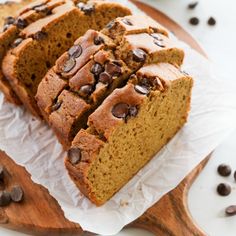 sliced loaf of chocolate chip pumpkin bread on a cutting board