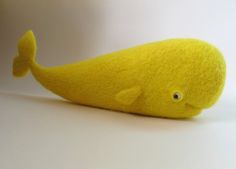 a yellow stuffed animal that looks like a whale