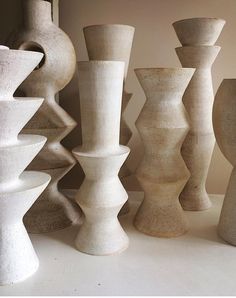 a group of vases sitting next to each other