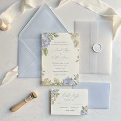 the wedding stationery is laid out and ready to be put into their guests'envelopes