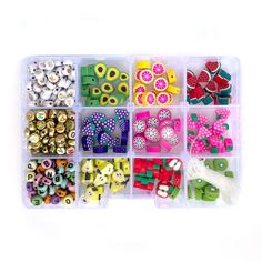 a plastic container filled with lots of different types of beads