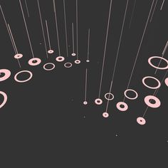 an abstract black and pink background with lots of circles on the bottom right hand corner