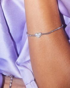 Like wearing your heart on your sleeve? Then the Ari Silver Pavé Heart Stretch Bracelet in White Crystal is perfect for you. Designed to fit any wrist, this minimal-yet-playful bracelet is the easiest way to bring some love and shine to your everyday stacks. Heart On Your Sleeve, Gift Subscription Boxes, Black Leather Bracelet, Blue Outfit, White Crystal, Heart On, Brass Material, Large Tote Bag, Crystal Heart