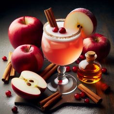 an apple cider cocktail garnished with cinnamon and apples