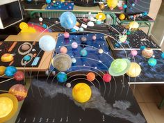 an assortment of solar system models on display