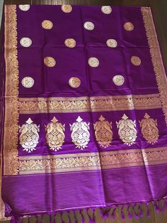 This is a beautiful handloom katan silk light weight banarasi in deep purple/ egg plant shade with beautiful sona rupa bird motifs in body and floral and bird motifs in gold zari in pallu, all in kadua weave. Saree comes with a stitched blouse in standard size 36-38. Saree is finished with tassels and falls and pico are done.  *colour may vary slightly due to lighting and individual device settings. *Falls and Pico- Yes * Tassels-Yes *Blouse-yes, standard size 36 with margin for size 38 * All sa Silk Banarasi Saree, Saree Blouses Online, Egg Plant, Banarasi Silk Saree, Bird Motif, Katan Silk, Readymade Blouse, Banarasi Saree, Saree Look