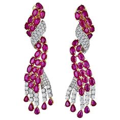 Beautiful earrings that resemble twisting Ruby and Diamond ropes. Set in 18k white and yellow gold the Oval and Pear-shape Rubies shine nicely off the diamond backcloth. Gold Oval Earrings, Noble Lady, Sparkling Jewelry, Vintage Drop Earrings, Diamond Earrings Studs Round, Expensive Jewelry, Ruby Earrings, Ruby Jewelry, Emerald Earrings