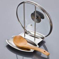 a wooden spoon sitting on top of a metal plate