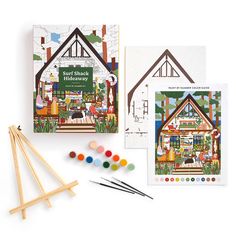 an assortment of crafting supplies including wooden sticks, paintbrushes and stick markers