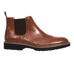 How many styles did we pack into this one? The Brayden is a gorgeous classic chelsea boot with wingtip design, brogue detail and a workwear-inspired lug sole. That means you can wear these everywhere: from your most formal event to a night out with the guys, the Brayden is right at home. Simulated leather upper, Slip on entry, Wing tip, Memory foam footbed, Rubber outsole | Men's Deer Stags Brayden Dress Shoes in Brown Size 16 Brown Slip-on Dress Shoes In Calf Leather, Semi-formal Calf Leather Dress Shoes With Brogue Detailing, Leather Wingtip Chukka Boots For Semi-formal Occasions, Brown Leather-lined Derby Shoes For Business, Semi-formal Leather Wingtip Chukka Boots, Chelsea Boots Mens, Brown Dress Shoes, Deer Stags, Shoe Carnival