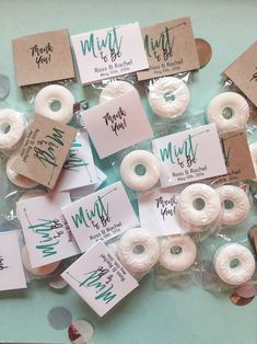 many donuts are wrapped in plastic and have tags on them that say mintt