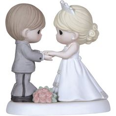 a figurine of a boy and girl holding hands