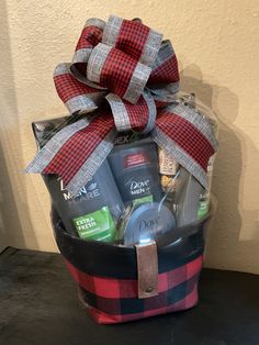 a red and black plaid gift basket filled with personal care products