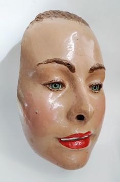 A rare vintage female face mask constructed with fibre glass circa 1950's. The mask measures approx 19cms by 13cms, is hand painted and has been fitted with real glass eyes. Possibly used as part of a fairground attraction or as part of a store display. In good vintage condition with only slight paint loss in certain areas so please study the photos. A very interesting item for display in the home or retail space / theatre / studio etc. Please note that the watch is just for scale and is not inc Female Face Mask, Optical Store, Film Props, Female Face, Female Human, Retail Space, Glass Eyes, Store Display, Retro Decor