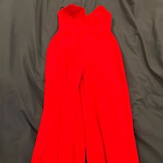 Red Long Sleeveless Jumpsuit, Brand New Never Worn Red Strapless Jumpsuit For Summer Party, Red Strapless Jumpsuits And Rompers For Party, Red Fitted Strapless Jumpsuit For Summer, Red Strapless Jumpsuit For Parties, Red Summer Formal Jumpsuits, Red Sleeveless Jumpsuits And Rompers For Date Night, Chic Red Strapless Jumpsuits And Rompers, Sleeveless Red Jumpsuits And Rompers For Date Night, Chic Red Strapless Jumpsuit For Evening