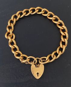 I don't usually sell gold plated jewelry but this came with a collection of other pieces and I have to say it is a really nice piece! This gold plated curb link bracelet measures 8 1/4 inches with a wonderful heart padlock clasp. The links measure 1/4 inch. The clasp works well and is secured with a safety chain. Weight 24.8 grams. Please go to my shop- CarterJewelry22- to see more jewelry pieces! Also, follow me on Instagram- CarterJewelry- I'm constantly getting in new pieces! Heart Padlocks, Sell Gold, Gold Plated Jewelry, Jewelry Plate, Chain Link Bracelet, Link Bracelets, Chain Link, Vintage Gold, Jewelry Pieces