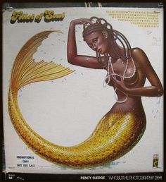 an image of a woman in a mermaid costume on the cover of planet of soul magazine