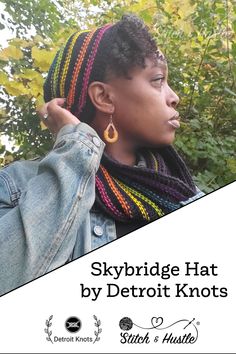 a woman wearing a knitted hat and scarf with the words skybridge hat by detroit knotts