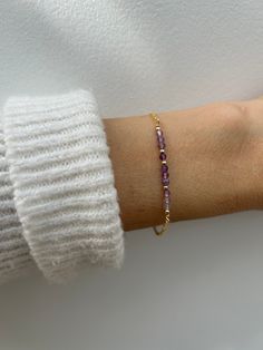 Beautiful crystals are combined with a dainty chain to create this beautiful bracelet.  Amethyst has been renowned for its beauty throughout the ages and is also the birthstone for anyone born in the month of February. D E T A I L S  *It features micro- faceted  shaded amethyst gemstones - separated by seamless gold filled/sterling silver beads. *Beads measure around 2.75mm and originate from Brazil. *Choose between and 18k gold filled chain, rose gold filled or 925 sterling silver chain. *Gold filled is a wonderful alternative to solid gold and unlike gold plating does not rub off. *It closes with a hall marked gold filled/sterling silver spring clasp. *Bracelet comes care instructions and a matching crystal information card and is ready for gifting. S I Z I N G * H E L P Choose the lengt Purple Beaded Birthstone Bracelets As Gift, Purple Birthstone Beaded Bracelets As Gift, Purple Beaded Birthstone Bracelets For Gift, Purple Birthstone Beaded Bracelets For Gift, Dainty Amethyst Jewelry With Adjustable Chain, Elegant Purple Birthstone Beaded Bracelets, Amethyst Crystal Bracelet Gift, Lavender Amethyst Crystal Bracelet As Gift, Adjustable Amethyst Beaded Bracelets With Birthstone