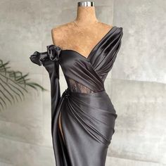 Elevate your evening ensemble with our Luxe Satin Asymmetrical Gown. This sophisticated masterpiece boasts a delicate balance of elegant draping and bold design, featuring a striking one-shoulder silhouette adorned with intricate ruffles. The rich satin fabric exudes opulence, while the form-fitting bodice accentuates your figure, creating an alluring and unforgettable look.The gown is designed with meticulous attention to detail, evident in the lace overlay that adds a touch of feminine charm. Long Sleeve Mermaid Prom Dress, Asymmetrical Gown, Satin Evening Dress, Women Suits Wedding, Lace Wedding Dress With Sleeves, Satin Evening Dresses, Draped Skirt, Luxury Wedding Dress, Short Bridesmaid Dresses