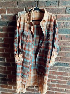 Washed Plaid Long Shirt-Washed Brown -Bleached Detail -Snap Buttons Closure -Relaxed Fit -Over Sized -100% Cotton Free Shipping Affordable Brown Long Sleeve Flannel Shirt, Flannel Shirt High Front Long Back, Cheap Vintage Brown Flannel Shirt, Affordable Brown Vintage Flannel Shirt, Faded Button-up Fall Top, Faded Button-up Top For Fall, Distressed Long Sleeve Shirt For Fall, Faded Long Sleeve Shirt For Fall, Brown Washed Long Sleeve Top