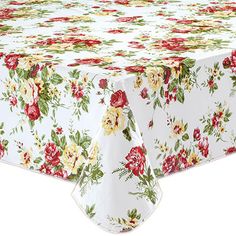 a white table cloth with red and yellow flowers on it, set against a white background