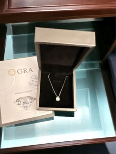 This Moissanite Pendant Platinum-Plated Necklace includes a certificate of the stone properties and a limited warranty card from the original overseas manufacturer for all pieces over 0.3 carats. Repairs are covered, but the purchaser will be responsible for return shipping costs. It also comes with a matching box for storage. Made with zircon accent stones, 925 sterling silver, moissanite, and platinum-plated material, this necklace features a minimalist design and measures 18 inches in chain l Luxury Faceted Silver Necklace, Luxury Sterling Silver Diamond Necklace With Square Pendant, Luxury Sterling Silver Box Chain Necklace, Luxury Silver Gemstone Pendant, Nickel-free Cubic Zirconia Pendant Necklace, Plate Necklace, Moissanite Jewelry, 3 Carat, Storage Boxes