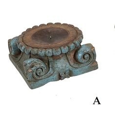 an old fashioned candle holder has been turned into a decorative piece with carvings on it