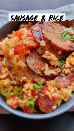 sausage and rice is being held by a wooden spoon with the words sausage and rice on it