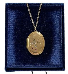 "Beautiful antique circa 1900s Art Nouveau era gold filled locket! This stylish oval locket has lovely bird in flight designs on the front, that is embellished with a rhinestones. The backside of the charm is free of any engravings. The antique locket is shown modeled on a 14k gold filled 18\" chain. A special piece of Art Nouveau era keepsake jewelry! ERA - Circa 1900s / Art Nouveau  METAL / MATERIAL - Gold filled locket, 14k gold filled chain, rhinestones MARKINGS / HISTORY - Chain is marked - \"14/20 GF\"  Pendant is partially marked on the back CK & Co. inside marked silver setting CONDITION - Good antique condition. Gold filled metal has been polished and cleaned. Age appropriate patina & wear remains. Rhinestones are secure. Amazing antique locket! SIZE / MEASUREMENTS - Chain Modeled 1900s Art, Bird In Flight, Antique Locket, Oval Locket, Keepsake Jewelry, Black Tie Event, Rhinestone Jewelry, Metal Material, Locket Necklace