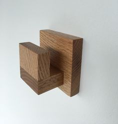 a wooden object is hanging on the wall