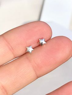 1 x pair of Tiny solid star stud earrings These delicate stud earrings are handmade of 925 sterling silver with a star design, bright and shine little cute one. Dimensions (approx): * 5x5 mm ✔ Nickel, Lead free & Hypoallergenic ✔ Perfect for sensitive skin ✔ Every order comes with a Beautiful gift box, ready for gifting WORLDWIDE SHIPPING All orders will ship within 1-2 working days once payment received * 3-5 working day for Australia wide * 10 -14 working days to USA * 14-20 working days REST Simple Silver Stud Earrings, Tiny Silver Earrings, Silver Earrings Stud, Aesthetic Stud Earrings, Silver Earrings Design, Fun Stud Earrings, Star Earrings Aesthetic, Dainty Star Silver Earrings, Cute Earrings Studs