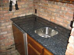 a kitchen counter with a sink in it