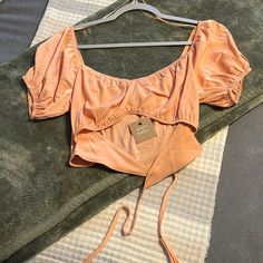 Light Orange Satin Material. Never Been Worn - New With Tags. Ties In The Front. Fitted Blouse For Beach, Crop Top For Day Out In Spring, Fur Top, Sheer Bodysuit, Orange Satin, Tie Dye Crop Top, Grey Blouse, Dot Skirt, Yellow Blouse