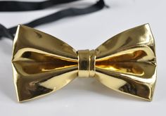 Mens PVC Faux Leather SOLID Gold Golden  Shining Bow Tie Bowties Wedding Party Item               PVC Faux Leather Gold Shining Bow Tie Condition      Brand New Color       GOLD Size               L 12cm*W6.5CM Material       Faux Leather Package       1  Gold  Color Faux Leather Bow Tie Due to the use of flash photography, there may be slight or no color variation of item described   Payment Payments options: ETSY PAYMENT   Shipping Product will be shipped within 24 Hours of receiving cleared p Elegant Gold Bow Tie For Party, Adjustable Gold Bow Tie For Party, Gold Bow Tie, Leather Bow Tie, Star Darlings, New Years Eve Outfits, Flash Photography, Tuxedos, Leather Bows